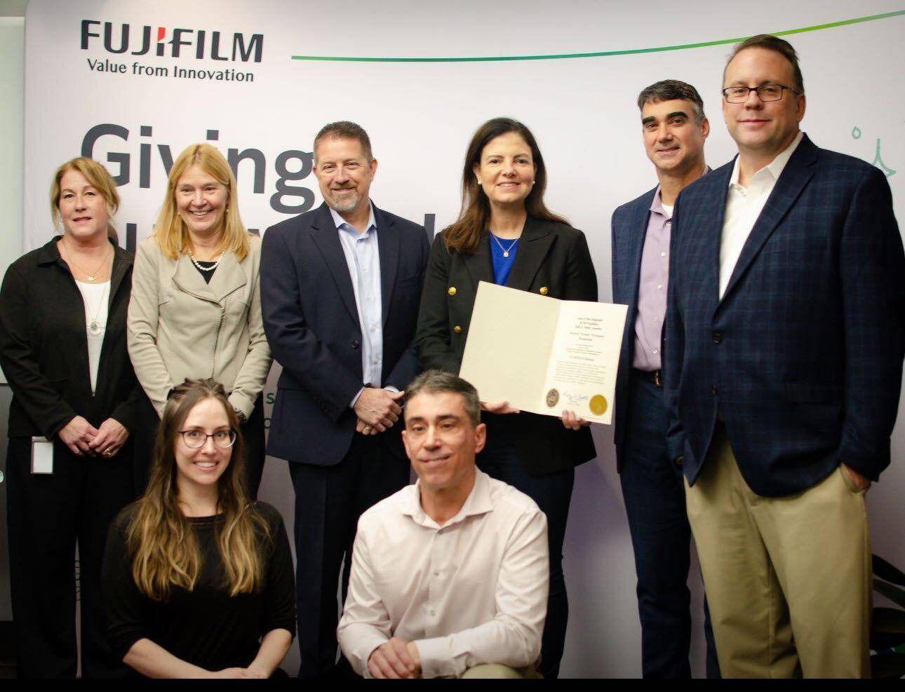 Governor Ayotte presents Fujifilm Dimatix's RFW designation.